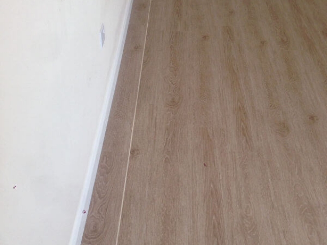 We supplied and fitted Brampton chase luxury Vinyl tile with a karndean feature strip